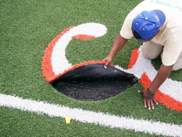 Repairing sports turf seam